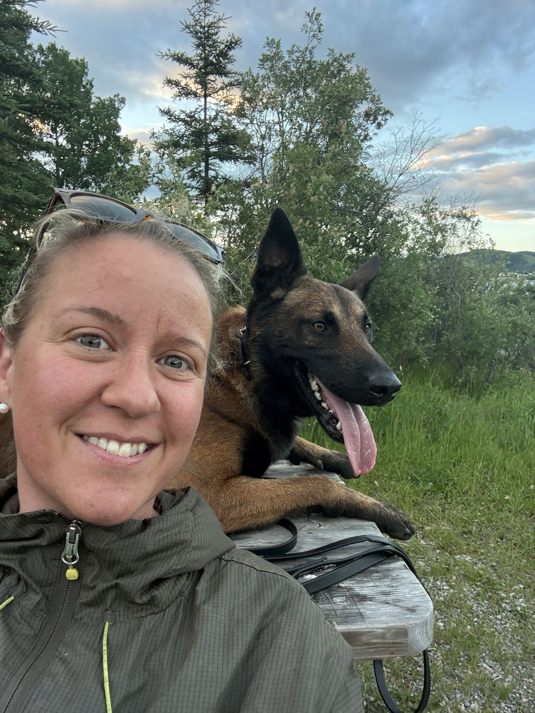 Dellie smiling with Scout outdoors